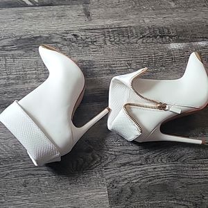 Pair of white high heel booties